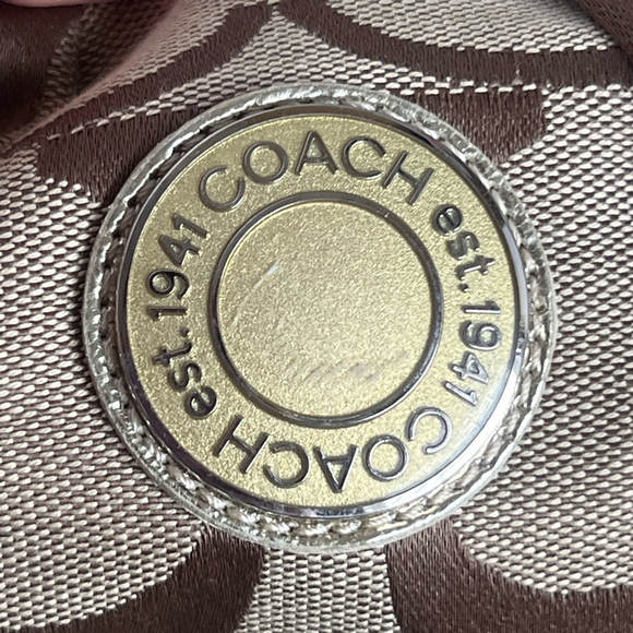 Coach Brown and Tan canvas with gold accents signature Backpack bag